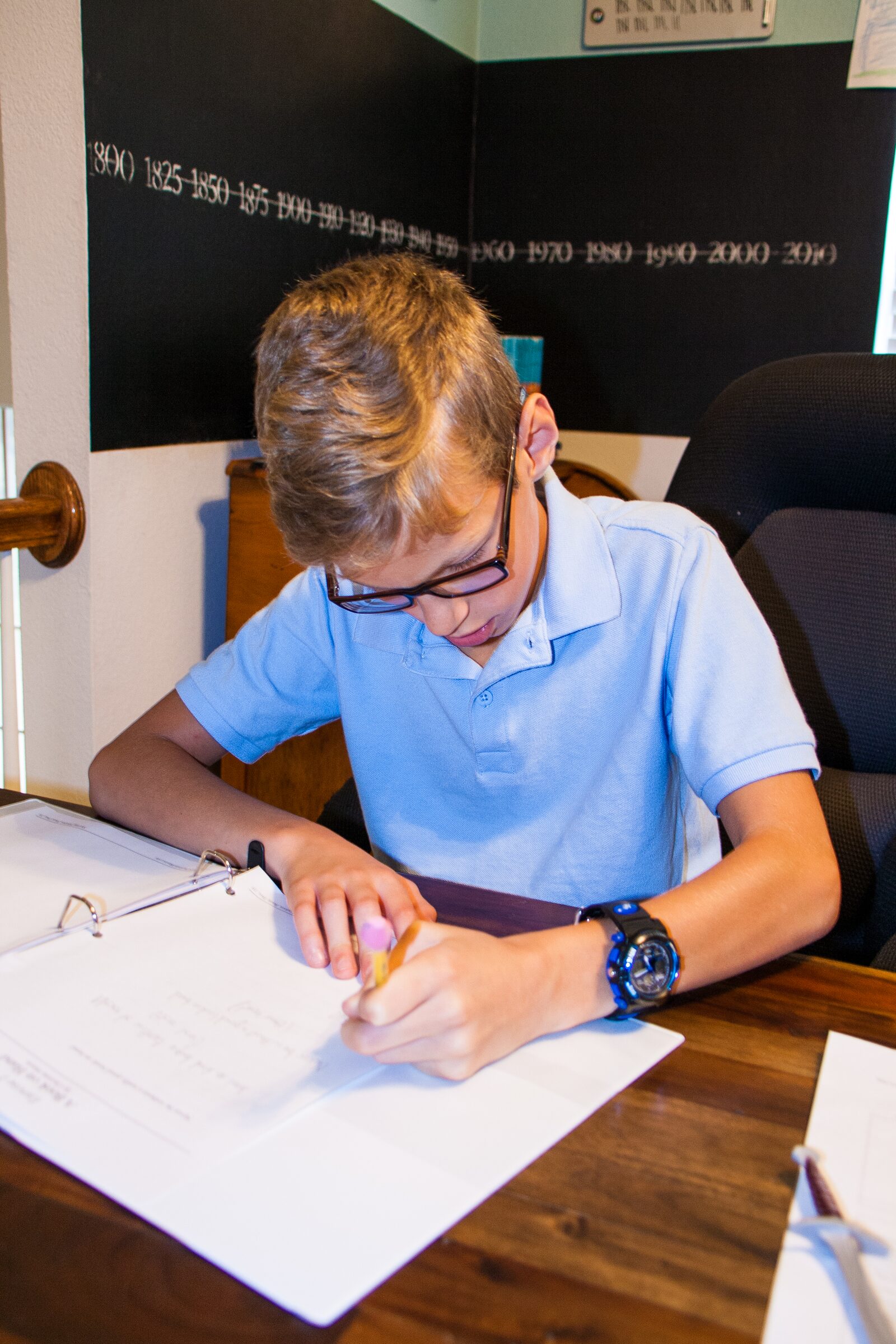 A middle-school student reading independently